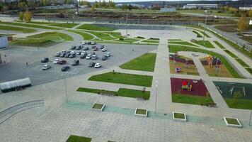 An Aerial View of a Park and its Associated Parking Lot Observed from Above and Beyond. Stock Clip video