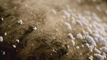 Ore mining in winter. Stock footage. Close-up of hot fossil releases steam on surface of earth. Extracted pile of mineral releases steam on winter day at quarry video