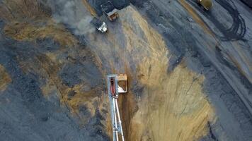Aerial view of heavy machinery at a mining site with ongoing construction and excavation. Stock Clip video