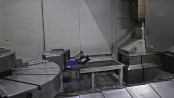Robotic machine at metalworking enterprise. Stock clip. Robotic parts of metalworking lathe. Automated machinery with metalworking machines video