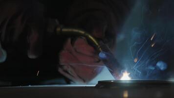 Welding Sparks Are Flying Fiercely in an Industrial Workshop Busy with Activities and Tasks. Stock Clip video