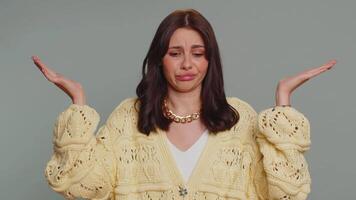 Confused woman feeling embarrassed about ambiguous question having doubts no idea clueless uncertain video