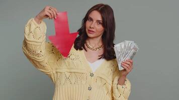 Upset woman showing red arrow pointing down, concept of downgrade bankruptcy money dollar fail, fall video