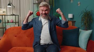 Excited happy old man surprised, shocked by sudden victory, good win news, celebrating, wow reaction video