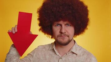 Upset bearded man showing red arrow pointing down, concept of downgrade bankruptcy money fail, fall video