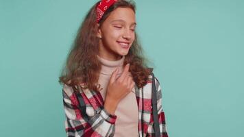 Smiling playful happy teenager child girl blinking eye winking and flirting expressing optimism video