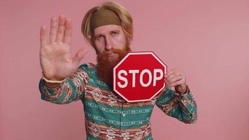 Hippie man say No hold inscription text red No stop danger sign, warning of finish prohibited access video