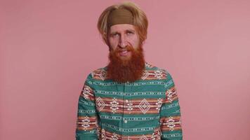 Offended hippie man having misunderstanding, frustrated after quarrel, ignores does not want talk video