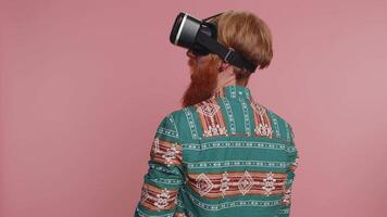 Man using virtual reality headset helmet app to play simulation innovation 3D game in VR goggles video