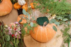 Creating a floral composition in a pumpkin. Making decor with your own hands. photo