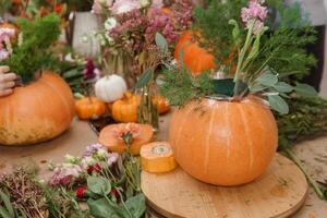 Creating a floral composition in a pumpkin. Making decor with your own hands. photo