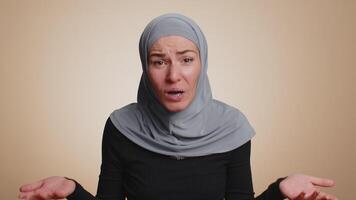 Woman raising hands in indignant expression ask why what reason of failure demonstrating disbelief video