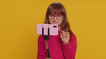 Child girl kid blogger taking selfie on smartphone communicating call online with subscribers video