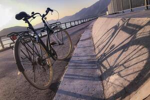 Vertical natural bicycle path, railing with shadow in outdoor park photo