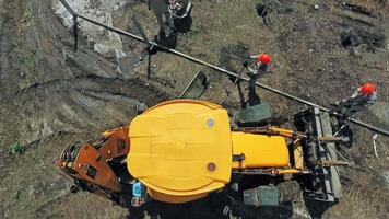 Tractor On Construction Site. Aerial view of site preparation and construction in progress video