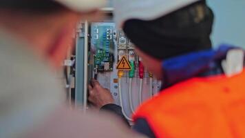 Control box of solar panels. Engineer working on checking and maintenance equipment in solar power plant video