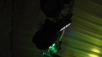 Stage spotlight with laser rays. Close up view of floodlights scene during concert video