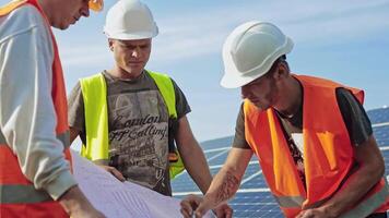 Engineer of solar plant reading the plan. Engineering team review and analyze information report of investment at solar power plant video
