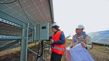 Man working at solar power station. Engineers working for checking solar power station video