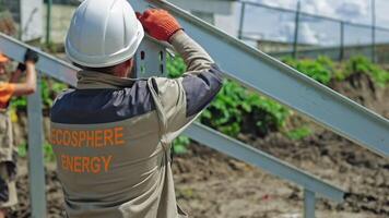 View of construction place. Worker on the construction site installing steel frame video