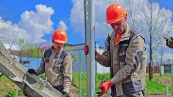 Group of builders at construction site. Professional engineer worker in protective uniform video