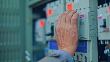 Engineer checks electrical box. Engineers checking solar panels running video