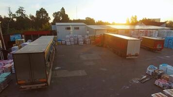 Aerial view of goods warehouse. Aerial view of storage and freight terminal with trucks video