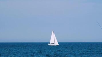 Ship Floating In Sea. Sailing boat with spinnaker sail in open sea video