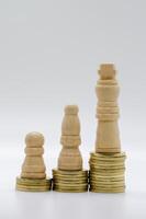 Status and ambition represented by pawns on golden coins with customizable space for text photo