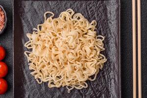 Rice noodles, asian food with soy sauce and spices photo