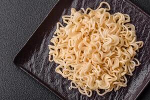 Rice noodles, asian food with soy sauce and spices photo