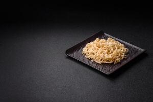 Rice noodles, asian food with soy sauce and spices photo