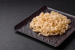 Rice noodles, asian food with soy sauce and spices photo