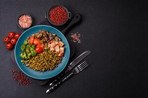 Quinoa bowl with tofu, steamed vegetables, grains, seeds and spices photo