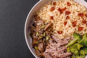 Rice noodles, asian food with soy sauce and spices photo