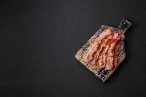 Bacon sliced, grilled with salt and spices photo