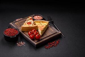 Delicious quiche with broccoli, cheese, chicken, spices and herbs photo