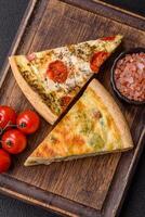 Delicious quiche with broccoli, cheese, chicken, spices and herbs photo