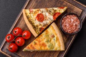 Delicious quiche with broccoli, cheese, chicken, spices and herbs photo