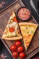 Delicious quiche with broccoli, cheese, chicken, spices and herbs photo