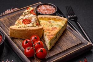 Delicious quiche with broccoli, cheese, chicken, spices and herbs photo