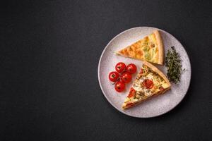 Delicious quiche with broccoli, cheese, chicken, spices and herbs photo