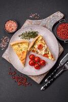 Delicious quiche with broccoli, cheese, chicken, spices and herbs photo