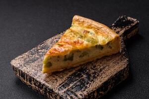 Delicious quiche with broccoli, cheese, chicken, spices and herbs photo