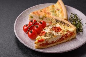 Delicious quiche with broccoli, cheese, chicken, spices and herbs photo
