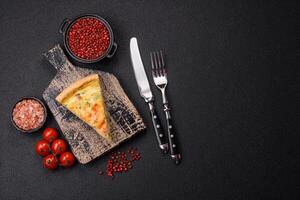 Delicious quiche with broccoli, cheese, chicken, spices and herbs photo