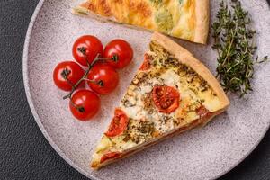 Delicious quiche with broccoli, cheese, chicken, spices and herbs photo