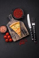 Delicious quiche with broccoli, cheese, chicken, spices and herbs photo