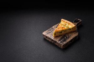 Delicious quiche with broccoli, cheese, chicken, spices and herbs photo