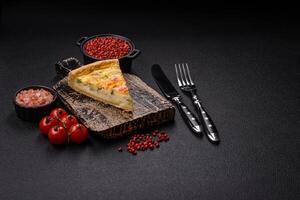 Delicious quiche with broccoli, cheese, chicken, spices and herbs photo